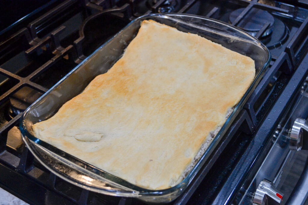 Golden brown sausage crescent casserole fresh out of the oven