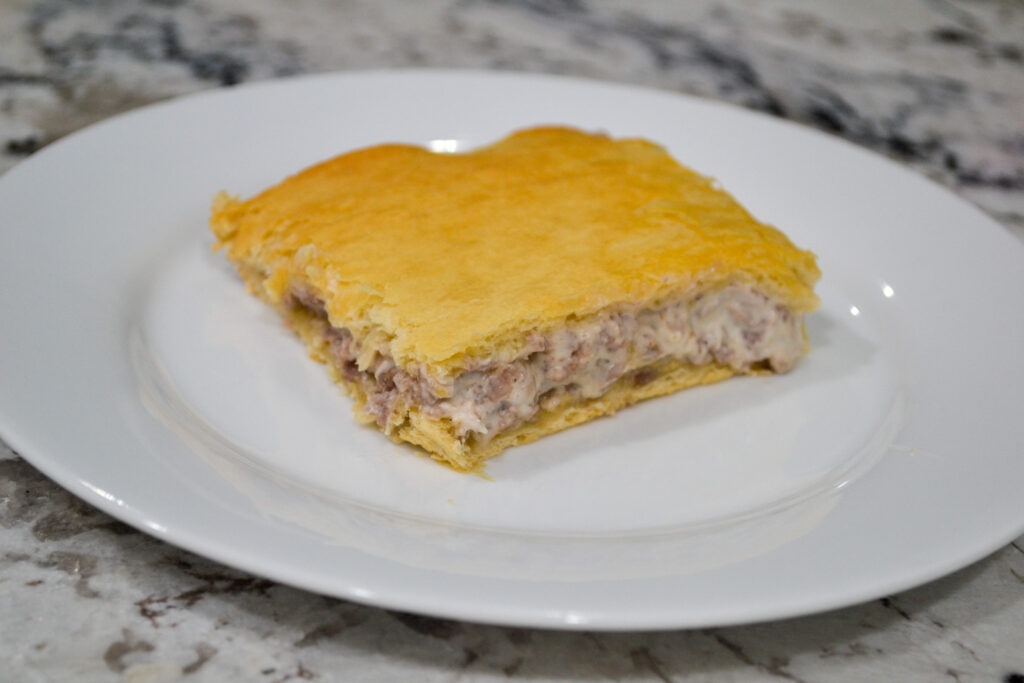 Sausage crescent breakfast casserole slice on a white plate