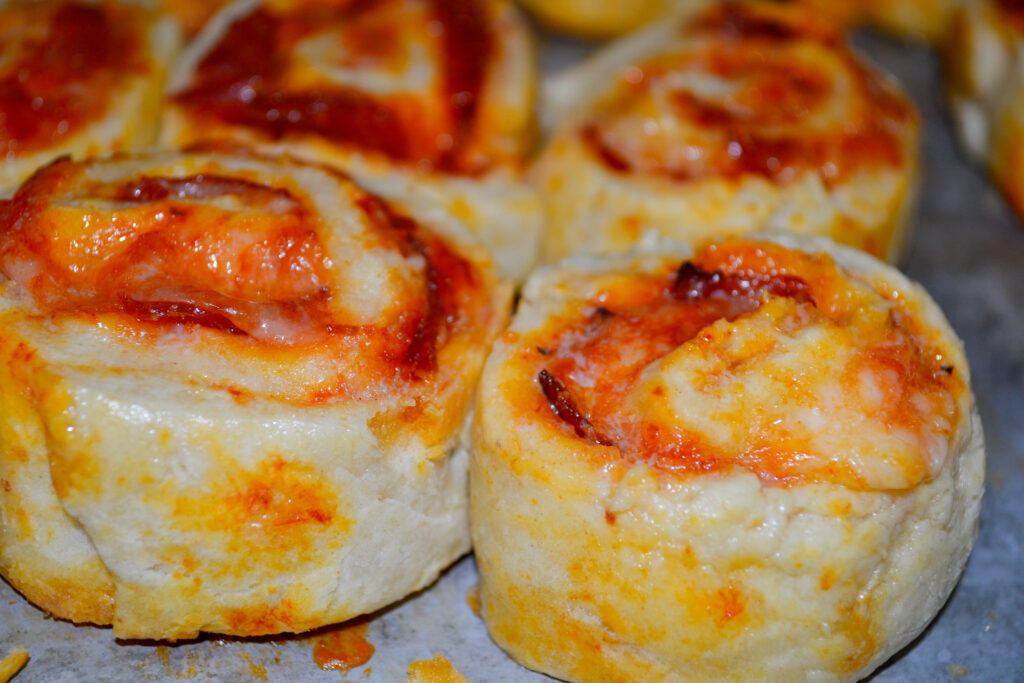 Close-up of a fluffy golden pizza pinwheel