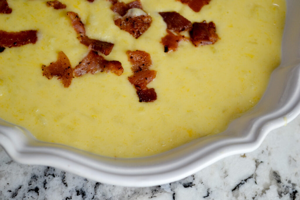 Close-up of creamy potato soup topped with crispy bacon
