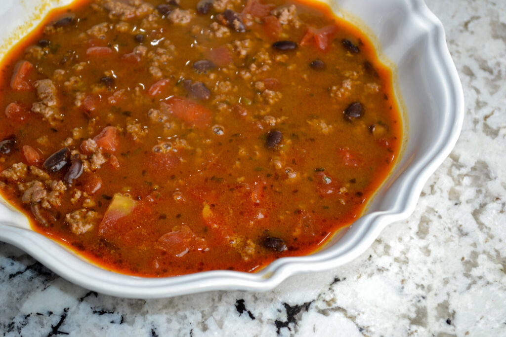 Bowl of 5-ingredient taco soup with ground beef and black beans