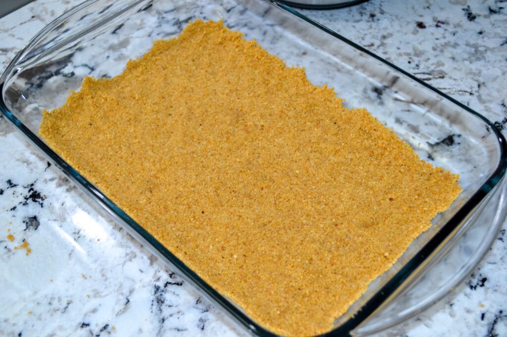 Graham cracker crust pressed into a glass 9x13 baking dish