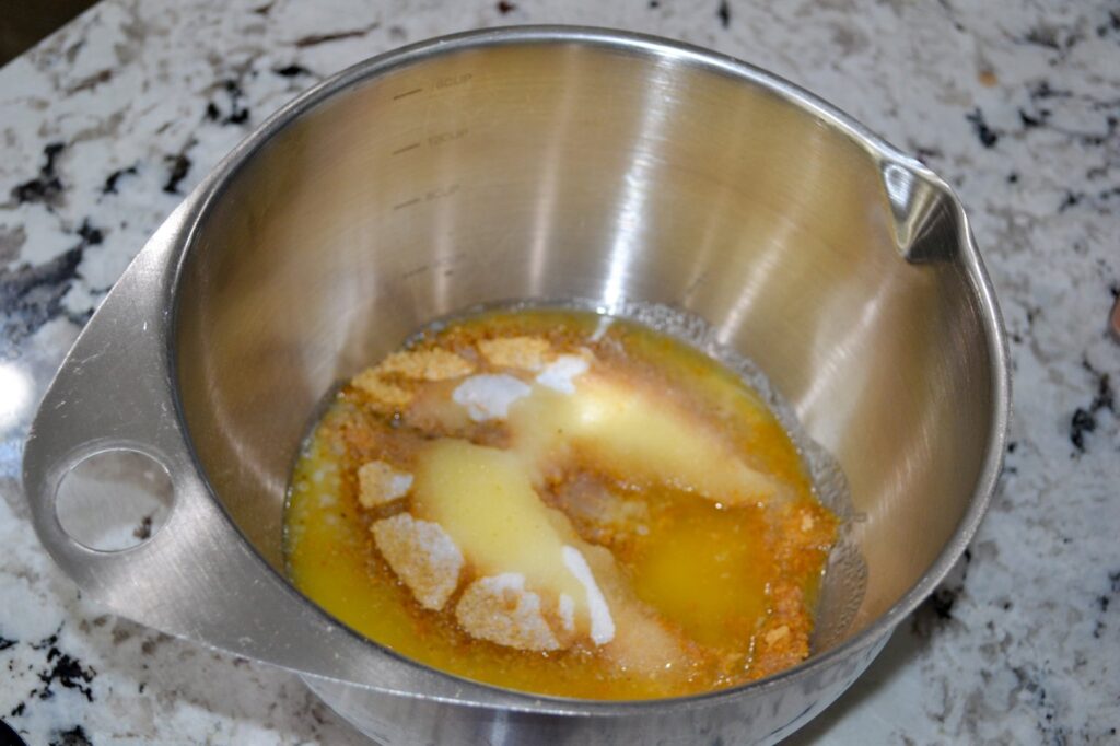 Graham cracker crumbs, melted butter and sugar in a mixing bowl for the crust